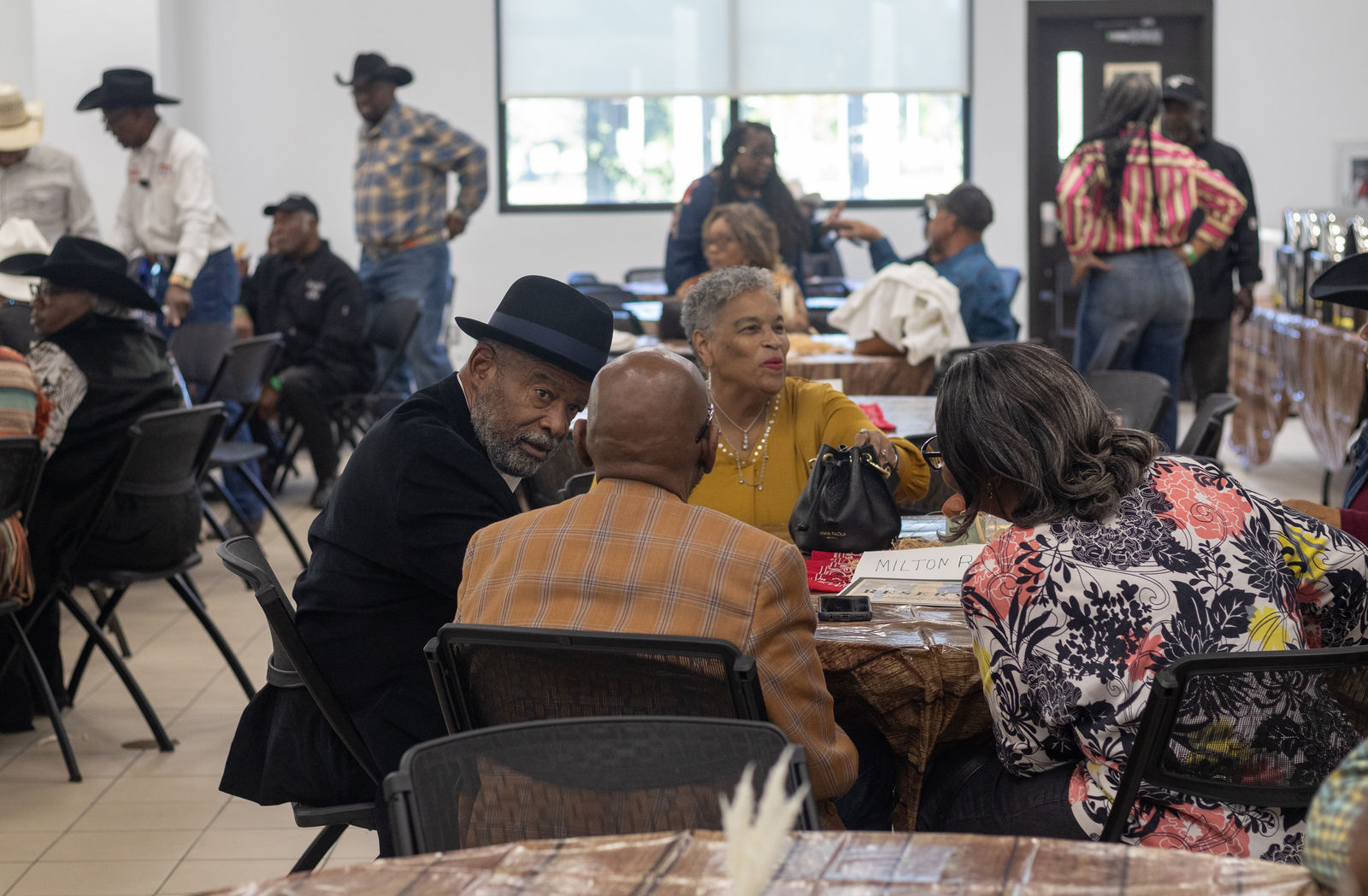 Guests visiting at reserved banquet tables